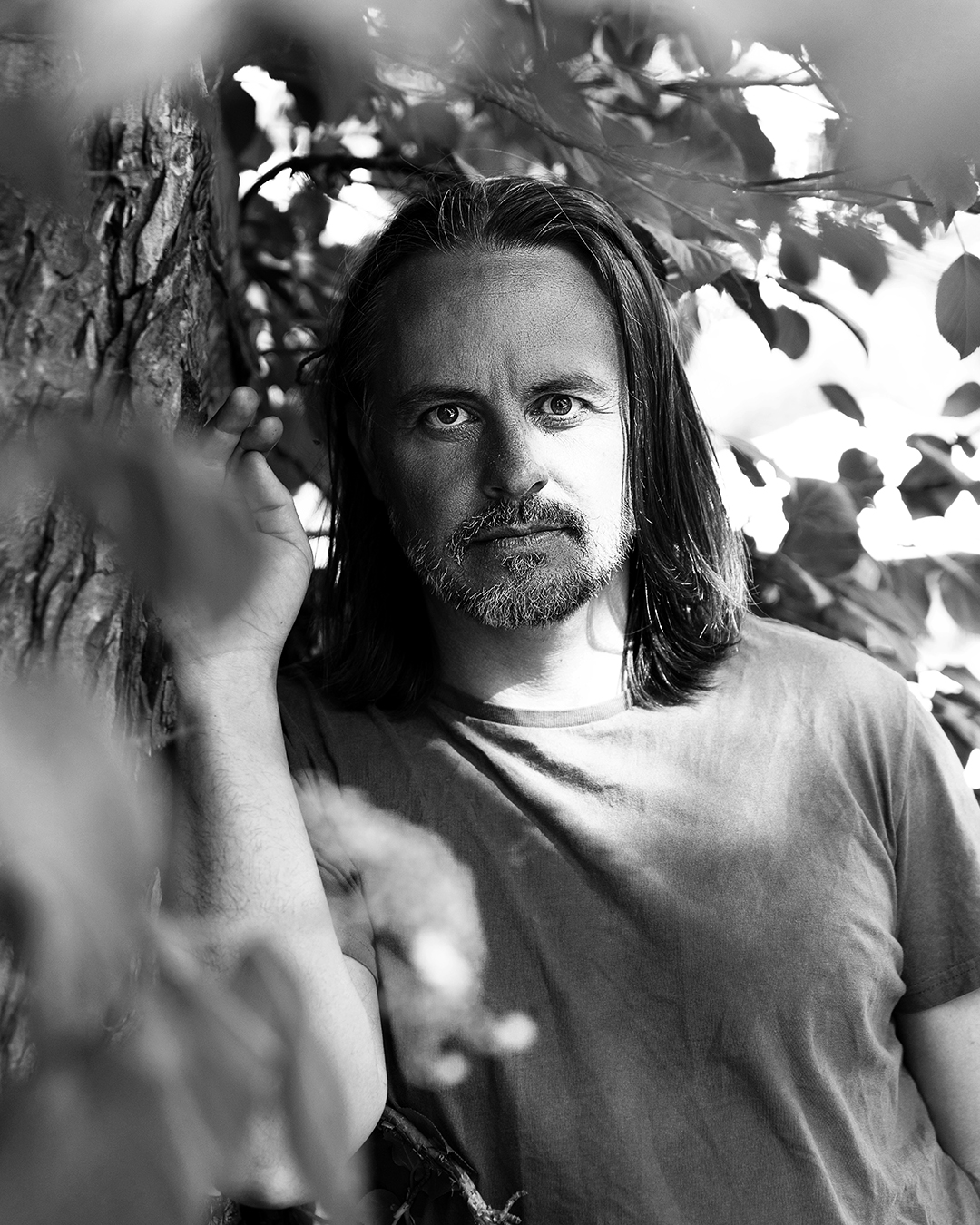 Black-and-white portrait of Gabriel von Post standing beside a tree